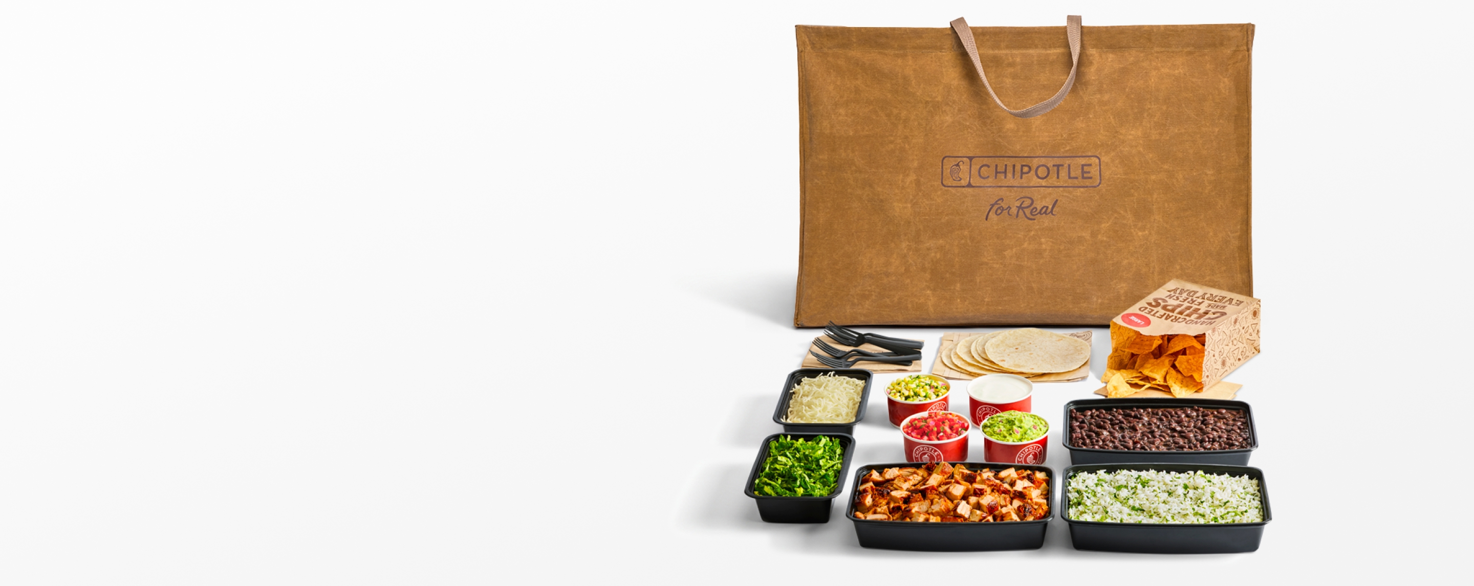 A Chipotle Big Ass Bag sitting behind a full Build Your Own Chipotle meal.
