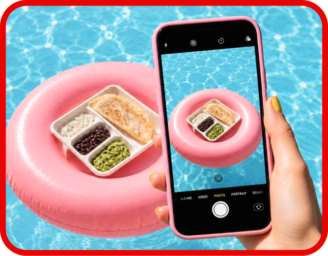 A smart phone taking a photo of the Salish Matter Kid’s Meal in a pink pool floatie.