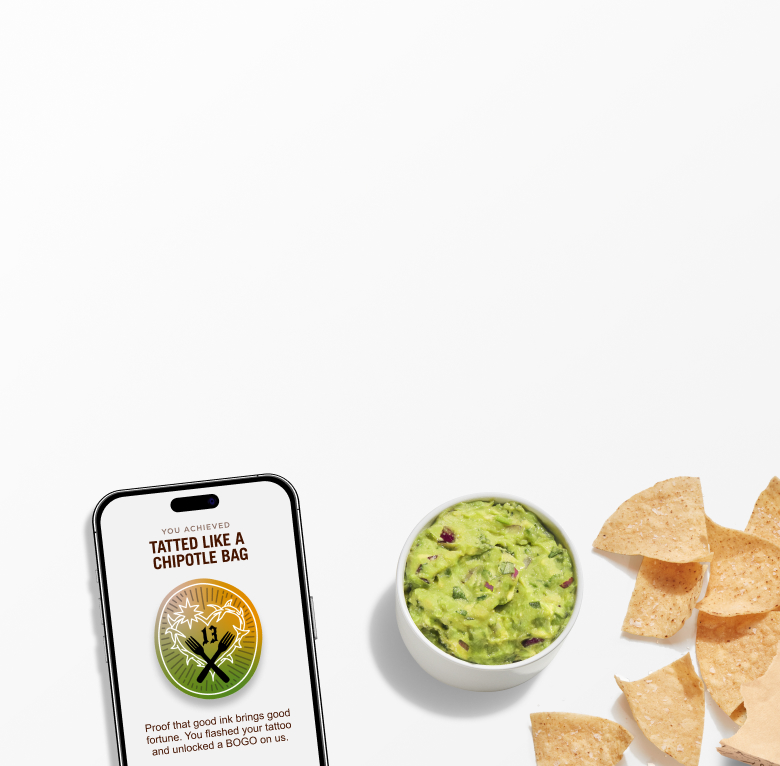 A side of freshly made Guacamole and Tortilla Chips laying beside a phone with the Tattoo BOGO Extra Badge.